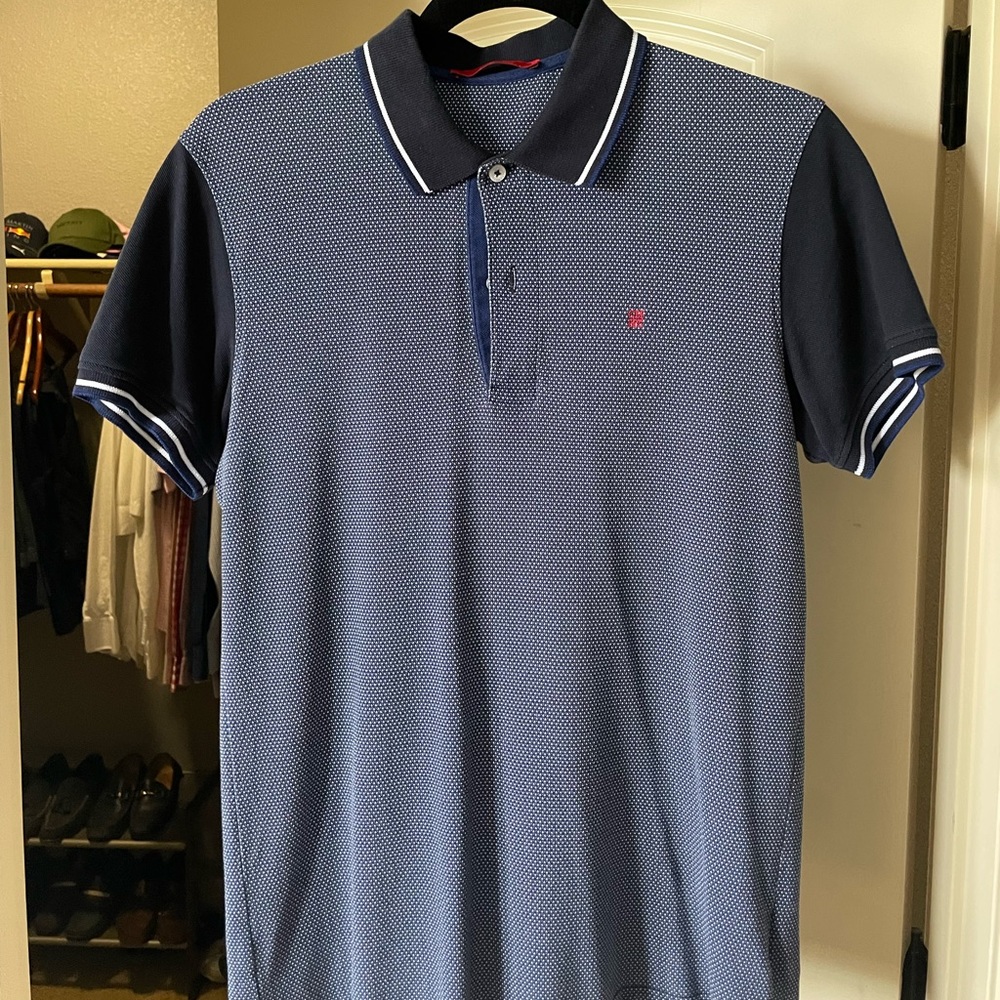 Carolina Herrera Mens Polo with triangle design.